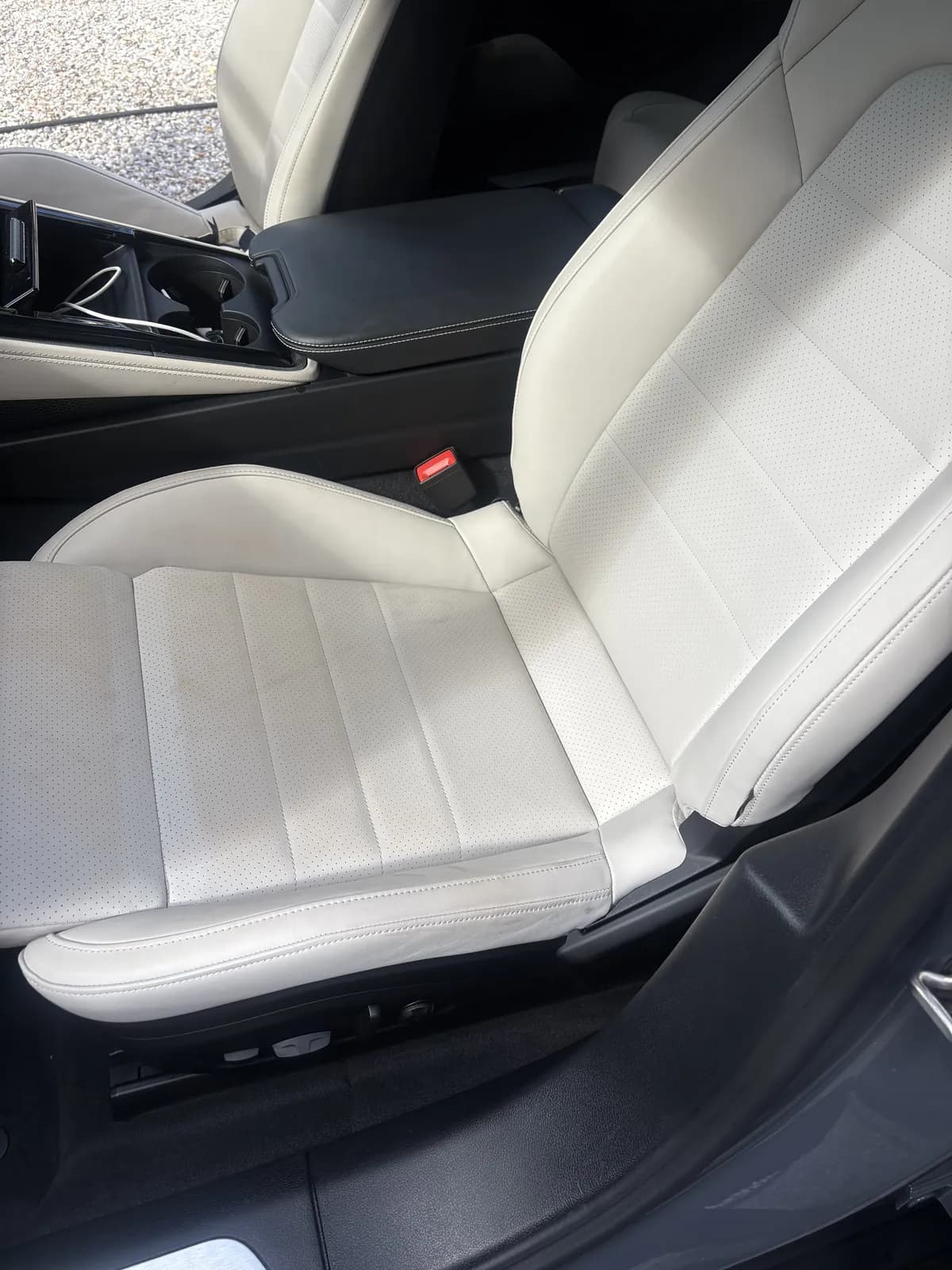 White leather Porsche Panamera driver seat before cleaning