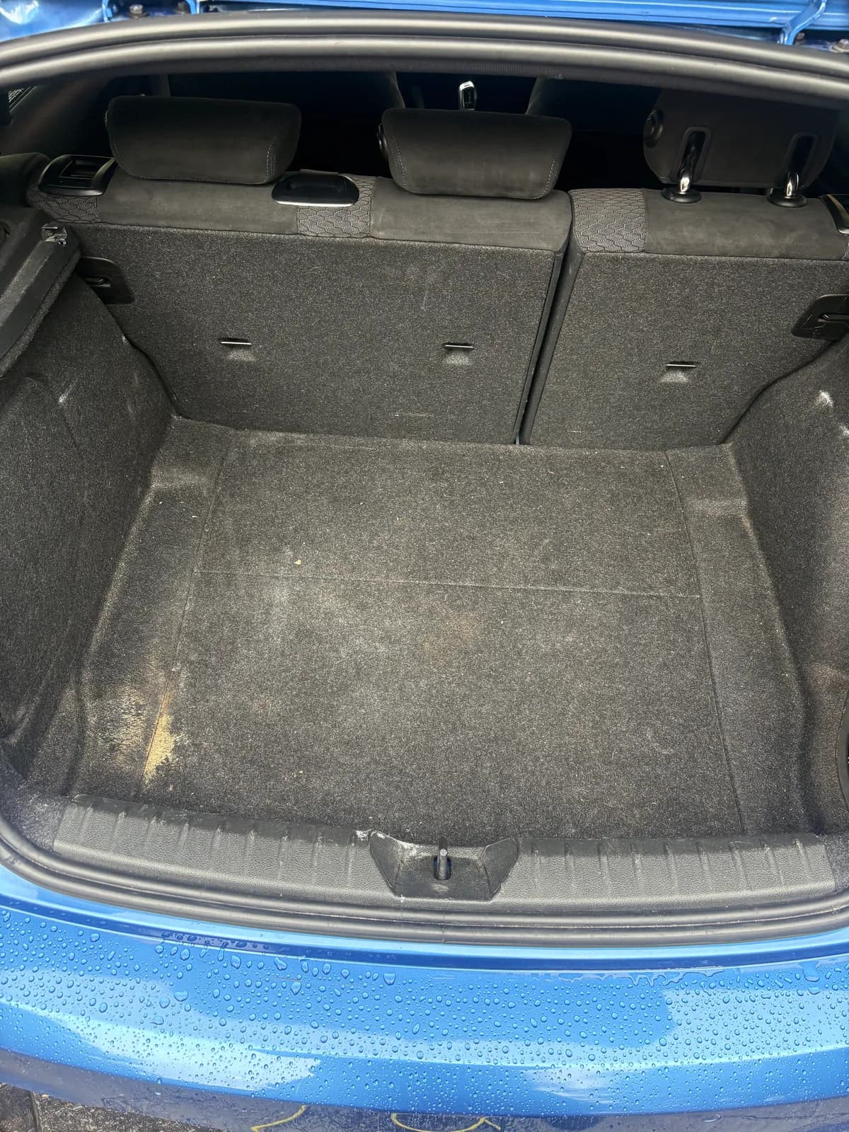 Blue BMW boot carpet before interior cleaning