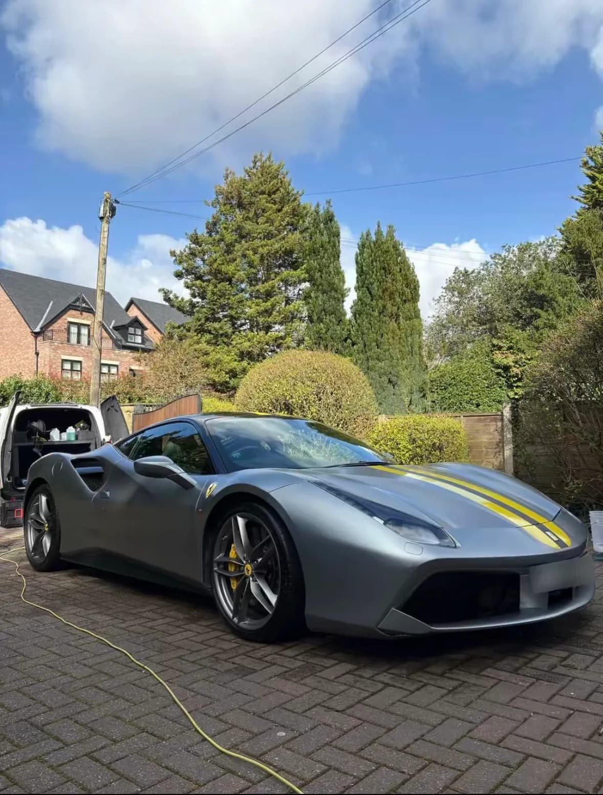 Grey Ferrari with yellow stripes